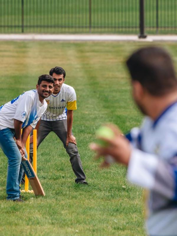 Graduate students play cricket